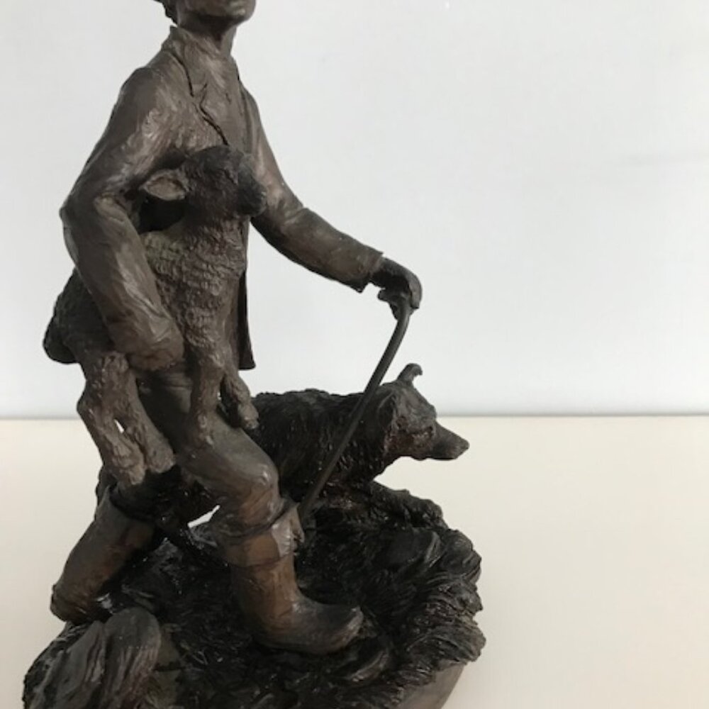 English bronze statue of shepherd, a baby lamb and the herding dog